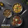 Three stainless steel pans with food, including a steak, potatoes, and mushrooms, arranged on a dark surface. Produktbild-Vorschau