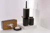 A set of black and wood bathroom accessories arranged on a white surface. Náhled obrázku produktu