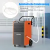 An orange and gray dehumidifier with a white hose connected to it, standing on wheels in what appears to be a garage or warehouse setting. Voir les images du produit