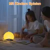 A woman and a child are sitting on a bed, reading a book. A bedside lamp is on. Produktbild-Vorschau