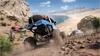 Off-road vehicles racing on a rocky, coastal terrain. Produktbild-Vorschau