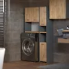 A modern laundry room setup with a washing machine and modular cabinets. Produktbild-Vorschau