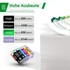 A stack of printer ink cartridges and a stack of paper with some pages fanning out. Produktbild-Vorschau