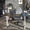 An office desk setup with an adjustable height desk, office chair, and shelves. Náhled obrázku produktu