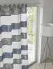A close-up view of a striped curtain with a floral pattern, hanging in front of a window. Produktbild-Vorschau