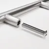 A close-up shot of a brushed metal cabinet handle and a screw on a white background. Produktbild-Vorschau