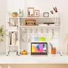 A white desk organizer shelf unit with various items on its shelves. Produktbild-Vorschau