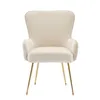 A cream-colored armchair with gold metal legs, photographed against a white background. Podgląd zdjęcia produktu
