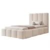 A bed with a headboard and frame upholstered in a textured cream fabric, shown with bedding and pillows. Produktbild-Vorschau