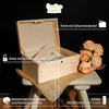 A wooden box with an open lid, placed on a stool with a burlap cloth. Flowers are arranged next to the box. Náhled obrázku produktu