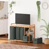 A laundry cart with multiple compartments and storage boxes is placed in a room, with a television on top. Voir les images du produit