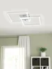 A modern ceiling light fixture with two overlapping square frames, mounted on a white ceiling. Podgląd zdjęcia produktu