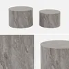 A collage of images showing two round coffee tables with a marble-like texture and a close-up of the texture. Anteprima dell’immagine prodotto