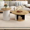 Two round coffee tables in a living room setting with a couch in the background. Produktbild-Vorschau
