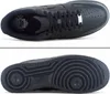 Two views of a black Nike Air Force 1 sneaker, one from the top and one from the bottom. Voir les images du produit