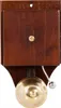 A retro-style doorbell made of wood and brass, mounted on a white background. Náhled obrázku produktu