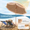 A beach scene with two people relaxing in deck chairs under a straw-covered umbrella. Produktbild-Vorschau