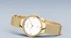 A gold Bering watch with a white face and diamond markers, presented against a plain light gray background. Produktbild-Vorschau
