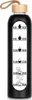 A black glass water bottle with a wooden lid and a time-marked label. Voir les images du produit