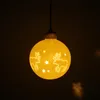 Boule LED en céramique pour pile avec motif de renne Voir les images du produit 3