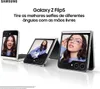 Three Samsung Galaxy Z Flip5 phones are displayed in different open positions, showcasing the screens with images of people. The phones are arranged on a white reflective surface. Náhled obrázku produktu