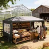 A market stall selling baked goods and produce, with a greenhouse and barn in the background. Voir les images du produit