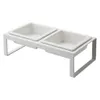 A white, elevated double pet bowl stand with two square ceramic bowls. Anteprima dell’immagine prodotto