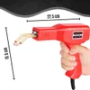 A hand holding a red plastic welding gun with gold heating elements. Produktbild-Vorschau