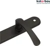 A close-up shot of a black door handle and plate against a white background. Produktbild-Vorschau
