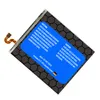 A battery with warning labels and address information. Produktbild-Vorschau