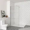 A modern bathroom with a toilet, a glass shower enclosure, and tiled walls and floor. Produktbild-Vorschau