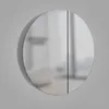 A round medicine cabinet with two doors, shown against a plain gray background. Anteprima dell’immagine prodotto