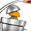 A close-up shot of a silver electric citrus juicer with an orange half being pressed. Náhled obrázku produktu