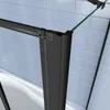 Close-up view of a black framed shower screen attached to a white bathtub, with a tiled blue wall in the background. Produktbild-Vorschau
