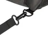 A close-up shot of a black carabiner clip attached to a black strap, which is connected to a dark grey fabric item. Náhled obrázku produktu