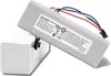 A rechargeable battery pack is shown resting on a white base. Náhled obrázku produktu