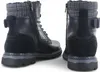 Two black boots are shown from the side and back on a white background. Anteprima dell’immagine prodotto