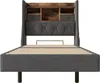 A front view of a bed frame with a headboard featuring storage compartments. Produktbild-Vorschau