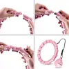 A collage of four images showing how to assemble a pink hula hoop and the final assembled product with its weight. Podgląd zdjęcia produktu