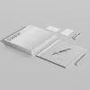 A product shot of an Onyx Boox Note Max e-reader, along with its packaging and accessories, arranged on a plain gray surface. Produktbild-Vorschau