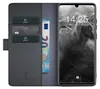 A black leather flip case for a smartphone, showing credit cards and a banknote inserted into the case. Produktbild-Vorschau