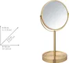 A gold-colored stand mirror with dimensions indicated by text and arrows. Produktbild-Vorschau
