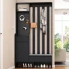 A black entryway storage unit with a bench, shelves, and hooks, featuring shoes on the bottom shelf and accessories on the upper shelves. Produktbild-Vorschau