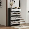 A shoe cabinet with multiple shelves and drawers, placed in a hallway next to stairs. Anteprima dell’immagine prodotto