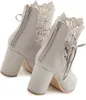A pair of gray lace-up ankle boots with block heels, shown from the back. Produktbild-Vorschau