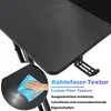A close-up of a black gaming desk with a carbon fiber texture, showing a hand cleaning the surface with a blue cloth. Text overlays highlight the material and its properties. Produktbild-Vorschau