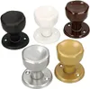 A collection of five different colored door knobs arranged in a grid. Produktbild-Vorschau
