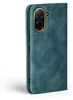 A teal-colored flip phone case with a gold-trimmed camera cutout is shown against a white background. Produktbild-Vorschau