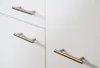 Close-up of cabinet handles on white cabinets. Produktbild-Vorschau