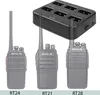 A multi-charger for walkie-talkies and three walkie-talkies are displayed on a white background. Anteprima dell’immagine prodotto